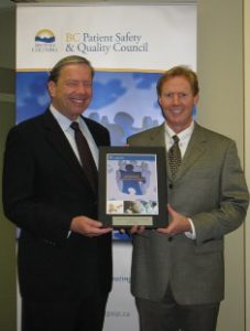 Dr. Julian Marsden (right) receives the 2009 Leadership in Quality and Safety Award from Dr. Doug Cochrane, BCPSQC Chair.