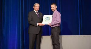 Bas Kervel accepting his plaque from BCPSQC Chair Doug Cochrane at Health Talks
