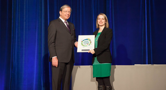 Angela Bedard, a member of the BC Cancer Agency’s Advance Care Planning Education initiative’s team, receives its plaque from BCPSQC Chair Doug Cochrane at Health Talks