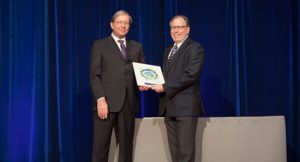 Michael Noble accepting his plaque from BCPSQC Chair Doug Cochrane at Health Talks